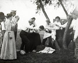 Beach event -- Picnic games, adults roughhousing