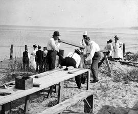 Beach event -- Men building sawhorse