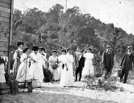 Beach event -- Group of women and men near building