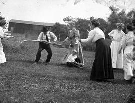 Beach event -- Lawn game with man, women, and child